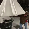 Ondergesneeuwde parasol