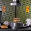 Hamburgers onder de pers