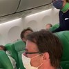 Coronagekkie in het vliegtuig