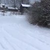 Sneeuwpret achter de auto