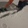 Sneeuwschuiven met de trekker